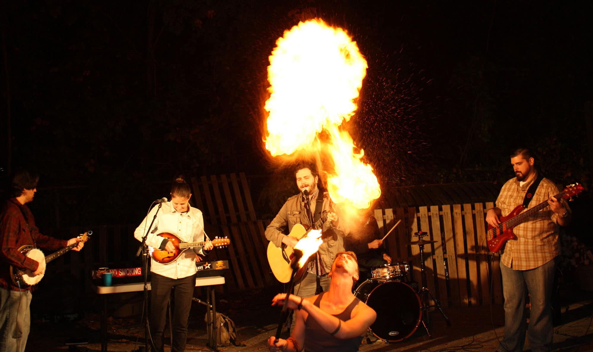 Pictured (LtoR) Cole Turpie, Pyrophilla fire dancer performing with Haint Blue (Photo courtesy KC Corbett, Clayworks marketing coordinator)