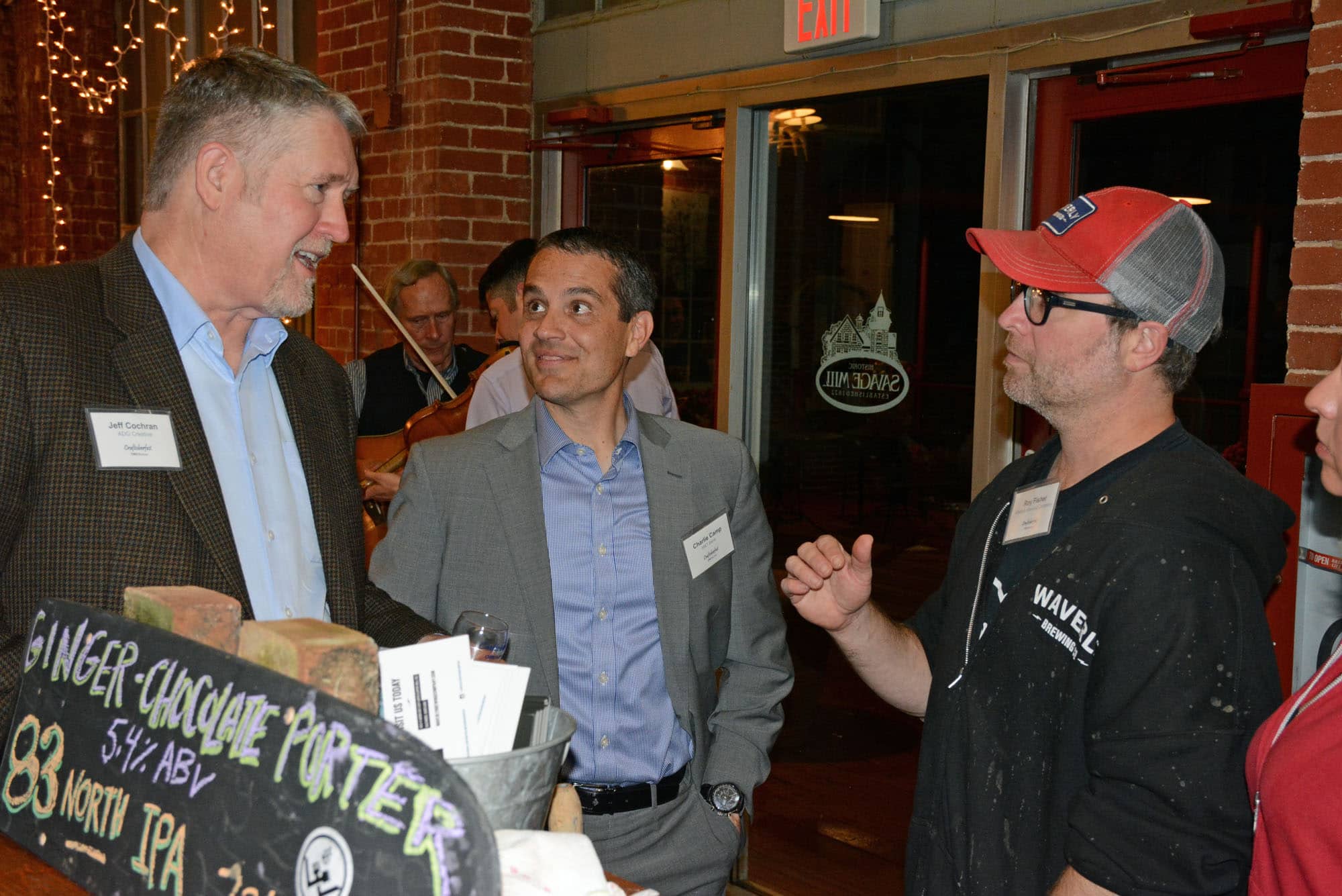 Jeff Cochran, ADG Creative business development director, and Charlie Camp, M&T Bnak business banking team leader, talk beer with Roy Fisher, Waverly Brewing Company's head brewer
